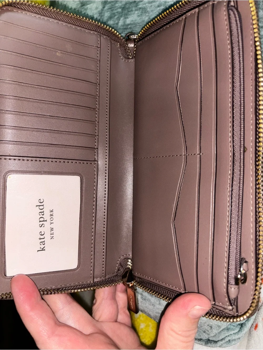 kate spade mauve zip-around wristlet with gold logo